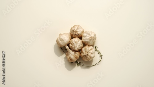 Garlic placed on a plain wh...