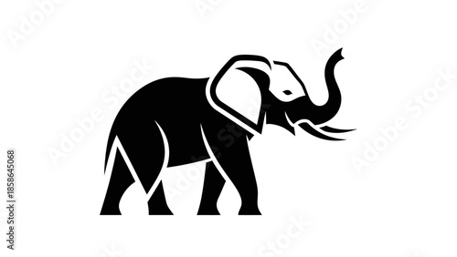 Majestic black elephant with raised trunk, isolated white background
