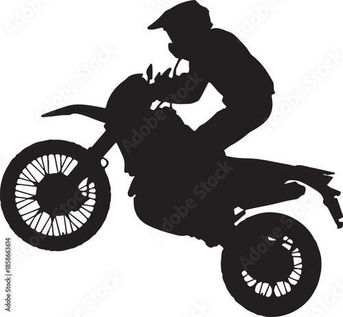 silhouette of a man riding a motorcycle