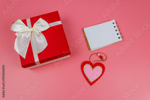 Wallpaper Mural Red gift box, Valentine heart and blank notepad on pastel pink background. Top view, flat lay. Valentine Day concept Torontodigital.ca