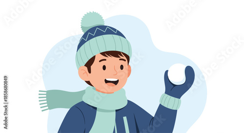 Happy young boy wrapped up in a heavy blue winter coat, knit hat, and scarf holds a white snowball ready for some winter fun.