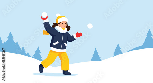 Young girl wearing winter clothes and a yellow hat throwing a snowball while playing outside in a snowy winter landscape with pine trees.