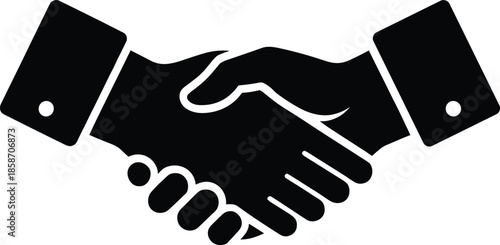 Handshake between two business professionals in formal suits symbolizing agreement, partnership, cooperation, and mutual understanding