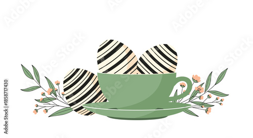 Artistic spring arrangement featuring three black and white striped Easter eggs nestled inside a sage green teacup surrounded by flowers.