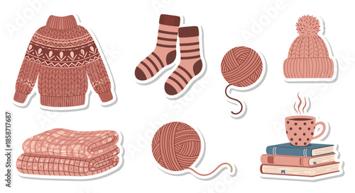 Set of cozy winter themed stickers including a warm sweater, socks, yarn balls, a beanie hat, books, and hot tea.