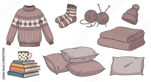 Collection of cozy winter lifestyle items including a knitted sweater socks yarn pillows books and a warm mug of coffee.