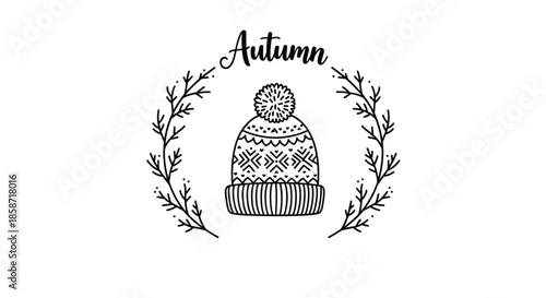 Knitted winter beanie with pompom framed by a leaf wreath and text autumn for seasonal fashion and cold weather concepts.