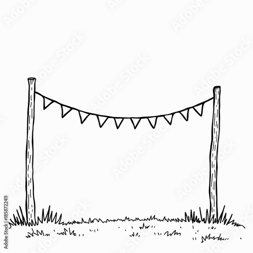 Hand-drawn bunting flags hanging between wooden posts in grass  