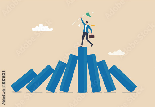Winner take all, survive business competition or strength to overcome difficulty, economic crisis or recession, business winner concept, success businessman on stand strong bar graph domino collapse. 
