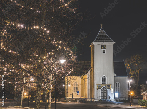 Drøbak church illuminated at night during winter