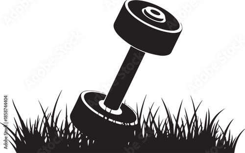 Silhouette of a dumbbell resting in grass outdoor fitness equipment for workout and exercise concept