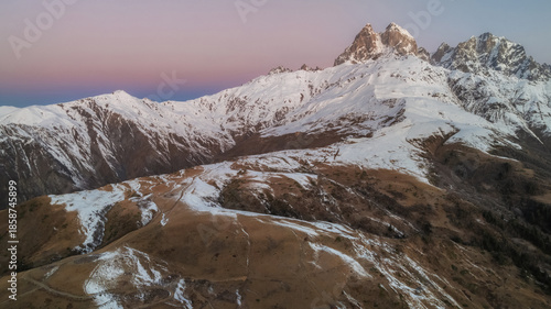 Bilde på lerret Distant Ushba mountain and pink sky.