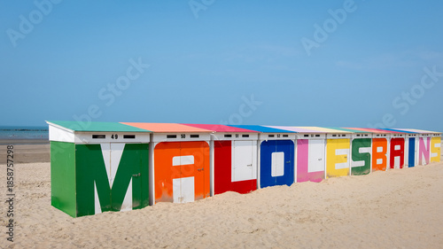 Fotografie Colorful beach huts on sandy beach in Malo-les-Bains, Dunkirk, France