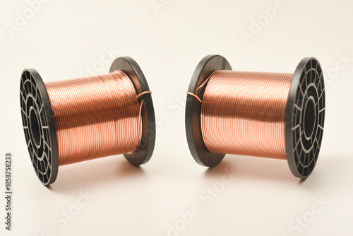 Copper coils on a white background. Copper wire for electronics. Pure copper.