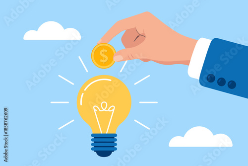 Business hand giving coin to light bulb symbolizing investment