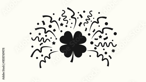 Black four leaf clover with confetti and streamers.