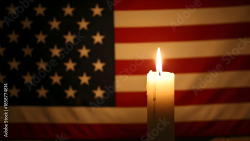 American flag with a lit candle on national day