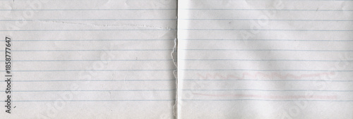 Clean lined notebook paper texture with subtle grain and soft off white tone. Minimal background suitable for education, writing, school concepts, stationery design and vintage paper layouts.