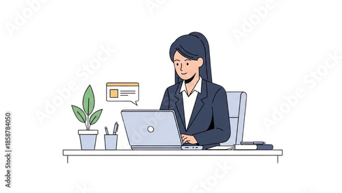 A professional woman working on a laptop at her desk in a modern office environment