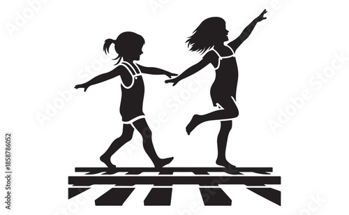 Two little girls crossing street holding hands in black silhouette