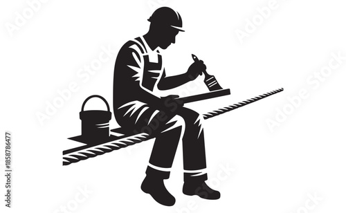 Construction worker taking a break sitting on steel beam with bucket