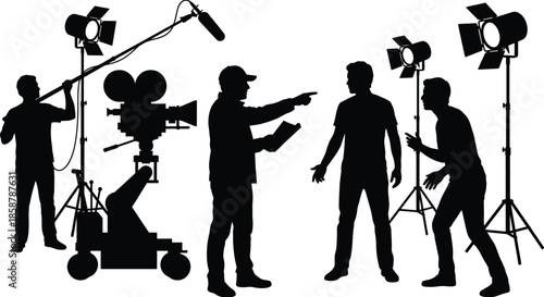 Silhouette of professional film director pointing finger while instructing actors on movie set with camera crew and boom operator recording sound under spotlights.