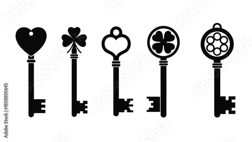 A collection of ornate black keys with different shaped heads shown in a row