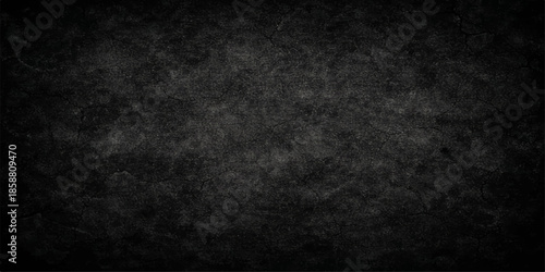 A dark and black grunge background featuring a textured stone wall pattern with an aged, dirty concrete surface and vintage paper gray wallpaper for a rough, blank backdrop design