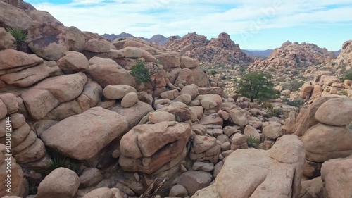 One mile loop hike through Hidden Valley Trail featuring scenic desert valley surrounded by massive rock formations in Joshua Tree National Park California