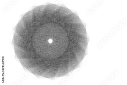 A grayscale image of a circular pattern with a white center