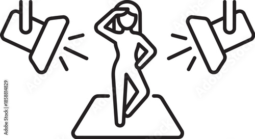 Woman model posing under studio spotlight during fashion photo shoot session on catwalk stage