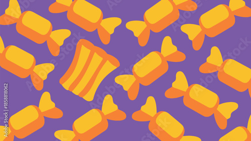 Vibrant orange candies on purple background for Halloween or sweet treats