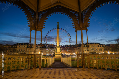 Ferris wheel and Jubilee Column at Schlossplatz Stuttgart at dusk
