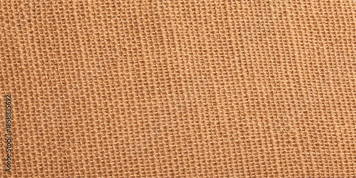 Closeup macro texture of a rough brown woven textile fabric material design for a background or backdrop