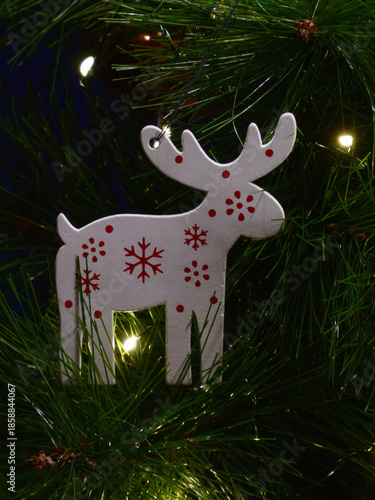 White Wooden Reindeer Ornament on Christmas Tree