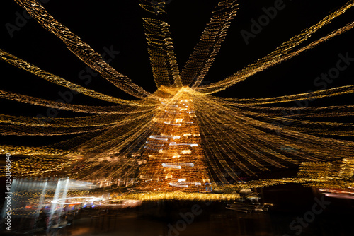 Christmas tree made with colored lights and long exposure. The effect of movement.
