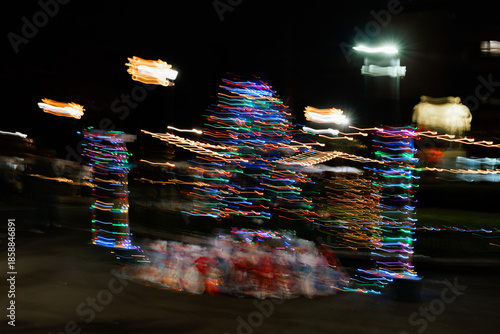 Christmas tree made with colored lights and long exposure. The effect of movement.