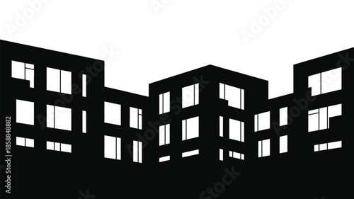 An abstract silhouette of modern city apartment buildings at night.