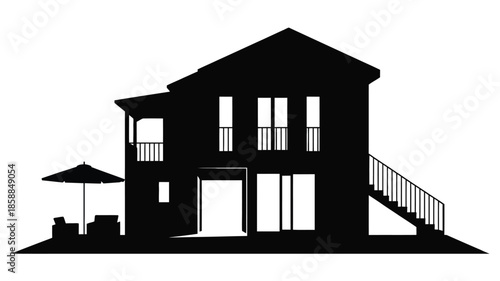 A modern two-story house with a balcony and patio.