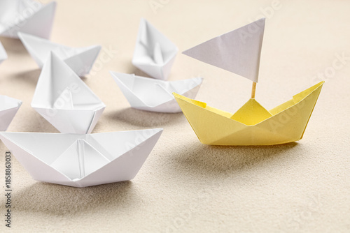 Wallpaper Mural One yellow origami boat white white ones on grey background. Leadership concept Torontodigital.ca