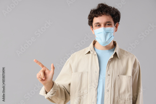 Young man in medical mask p...