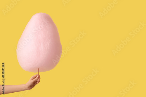 Hand holding pink cotton ca...