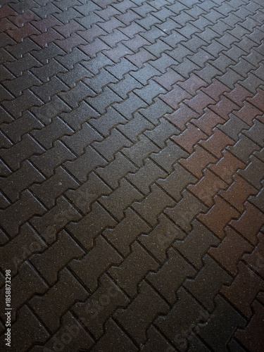 Abstract background of tiles on pavement at night