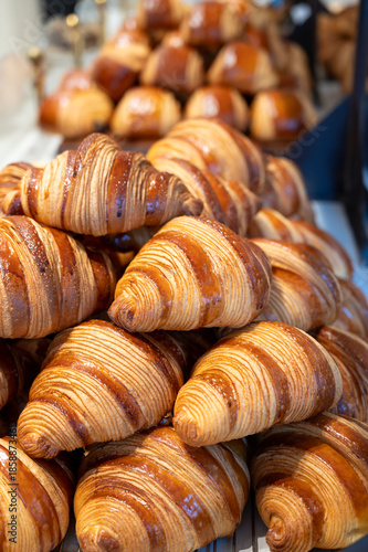 Fotografie Breakfast in France, fresh baked butter croissants pastries in artisanal bakery