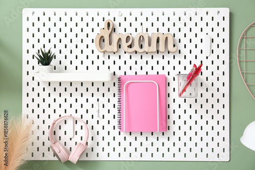 White pegboard with wooden ...
