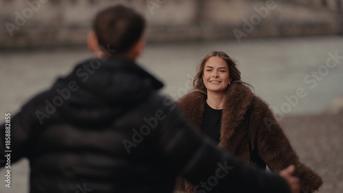Canvastavla A romantic couple reunites in Paris France with a woman in a fur coat smiling at her partner The image captures love and affection in an urban setting suitable for travel and relationship themes