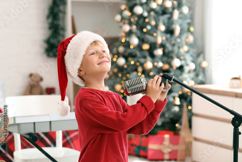 Cute little boy in Santa ha...