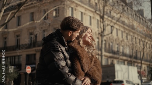 A romantic couple embraces in Paris France showcasing love and affection against a backdrop of classic cityscape architecture The image is suitable for travel lifestyle and relationship themes.
