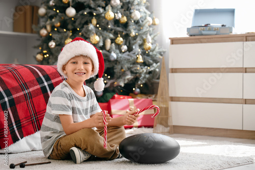 Cute little boy in Santa ha...