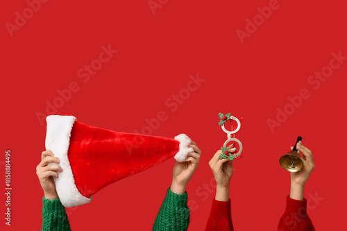 Female hands with Santa hat...